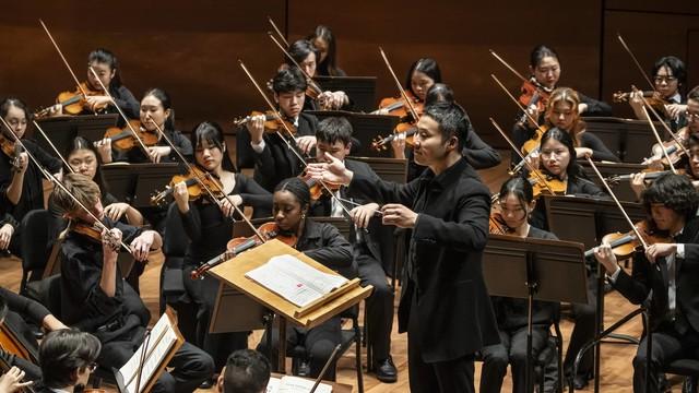 conductor performing with orchestra